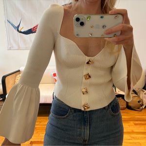 self portrait white top with bell sleeves and gold hardware thick knit
